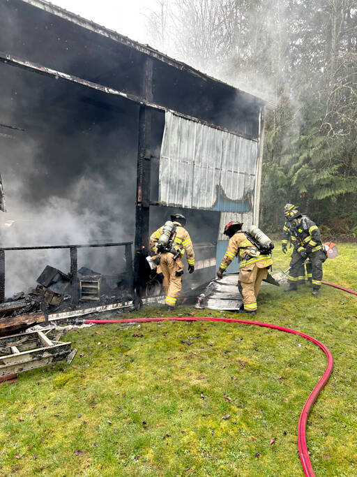 East Jefferson Fire Rescue firefighters work to extinguish a structure fire on Tuesday near the intersection of Lupine and South Jacob Miller roads. (East Jefferson Fire Rescue)