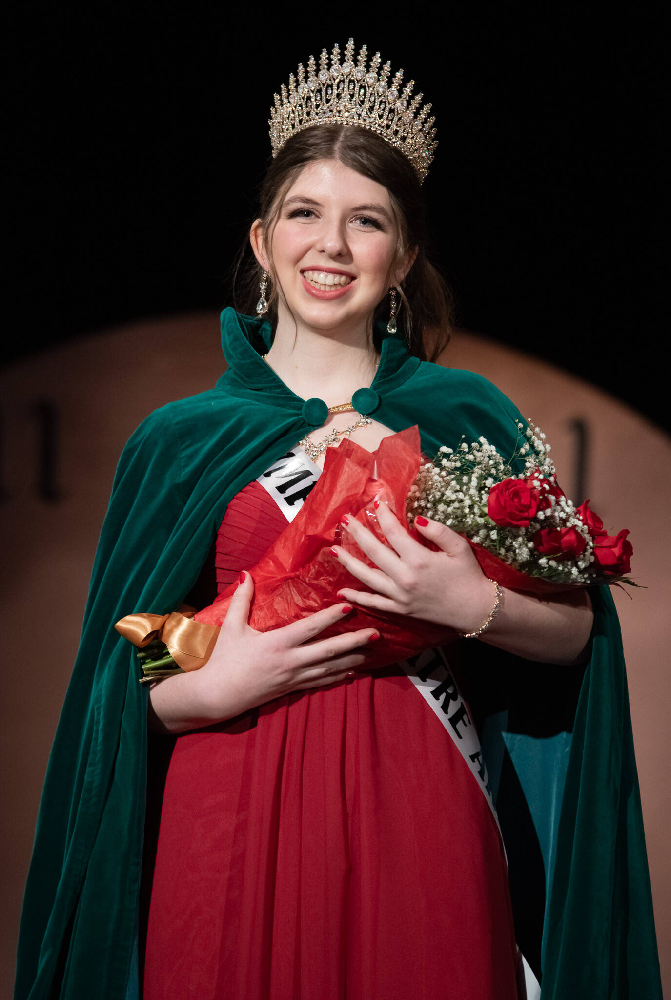 The 130th Irrigation Festival’s queen, Lily Tjemsland, receives her crown after participating in the scholarship pageant, which included a monologue performance, a dance routine with her fellow contestants and answering questions, both on stage and off. (Emily Matthiessen/Olympic Peninsula News Group)