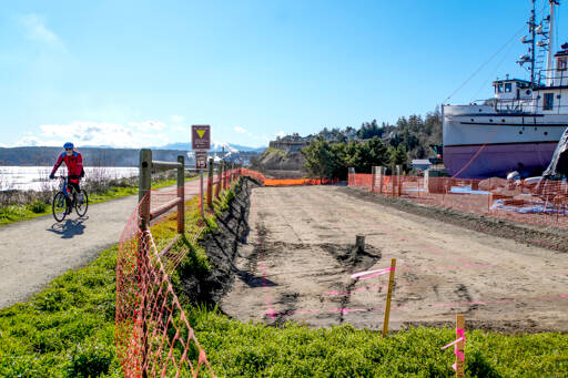 A bicyclist out on a Thursday afternoon ride reaches the trailhead along the Larry Scott Trail. The Port of Port Townsend is working to have cleaner water coming from the boatyard with a stormwater improvement project in the area. The project is designed to improve the environmental conditions of the working waterfront, which provides 20 percent of the jobs in Jefferson County. (Steve Mullensky/for Peninsula Daily News)
