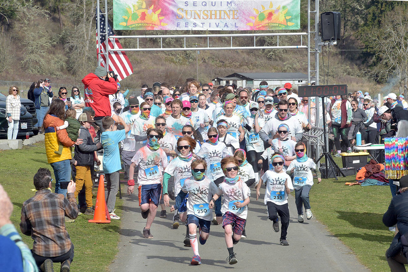 Participants in the Sequim Sunshine Festival Sun Fun Color Run take off from the starting line on Saturday at the Albert Haller Play Fields near Carrie Blake Park. The two-day festival featured numerous activities, food, music and a drone show on Saturday night. (Keith Thorpe/Peninsula Daily News)