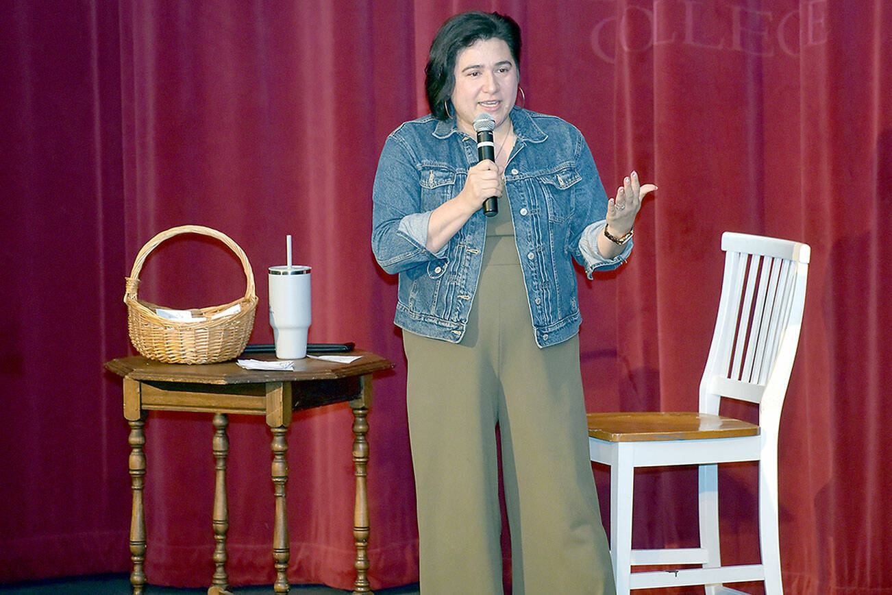 U.S. Rep. Emily Randall, D-Bremerton, speaks about current issues during a town hall meeting on Saturday in the Little Theater at Peninsula College in Port Angeles. Several hundred people attended, including an overflow audience in the Pirate Union Building. (Keith Thorpe/Peninsula Daily News)