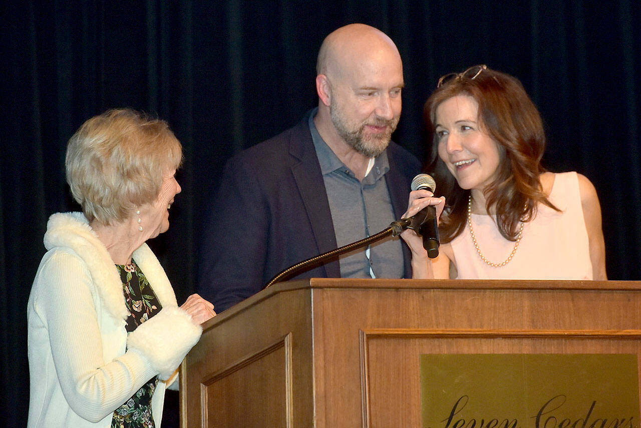 Family members of the late Mike McAleer, from left, McAleer’s wife, Shannon Burke, son Michael McAleer and daughter Colleen McAleer, accept the Clallam Economic Development Council’s Olympic Leader Award at Friday’s annual EDC Gala at 7 Cedars Casino in Blyn. (Keith Thorpe/Peninsula Daily News)