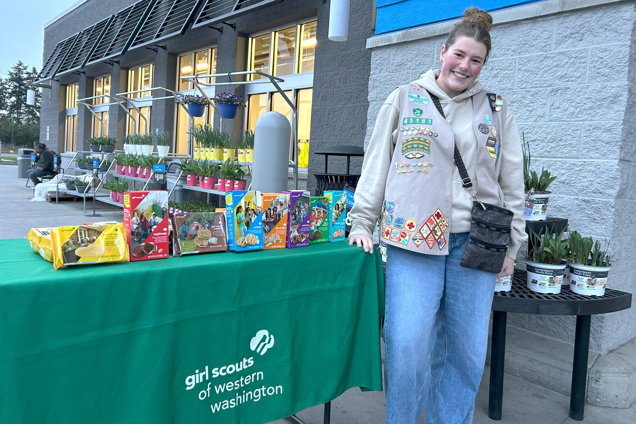 Skylar Krzyworz stands outside Walmart on March 7, when she hit the milestone of selling her 25,000th box of Girl Scout cookies. “Girl Scouts has been something that I never realized was going to have such a big impact on me,” she said. “And then after being in it for 13 years, I don’t know what I would do without it in my life.” (Matthew Nash/Olympic Peninsula News Group)