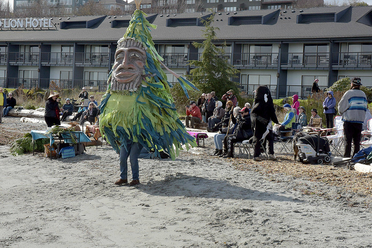 Danielle Fodor of Irondale cavorts as a dancing tree during Saturday’s World Water Day festivities at Hollywood Beach in Port Angeles. The international event served as a call to action to advocate for sustainable management of fresh water resources and environmental conservation. In Port Angeles, the celebration included a water blessing and guided hikes on local trails in the Elwha River watershed. (Keith Thorpe/Peninsula Daily News)