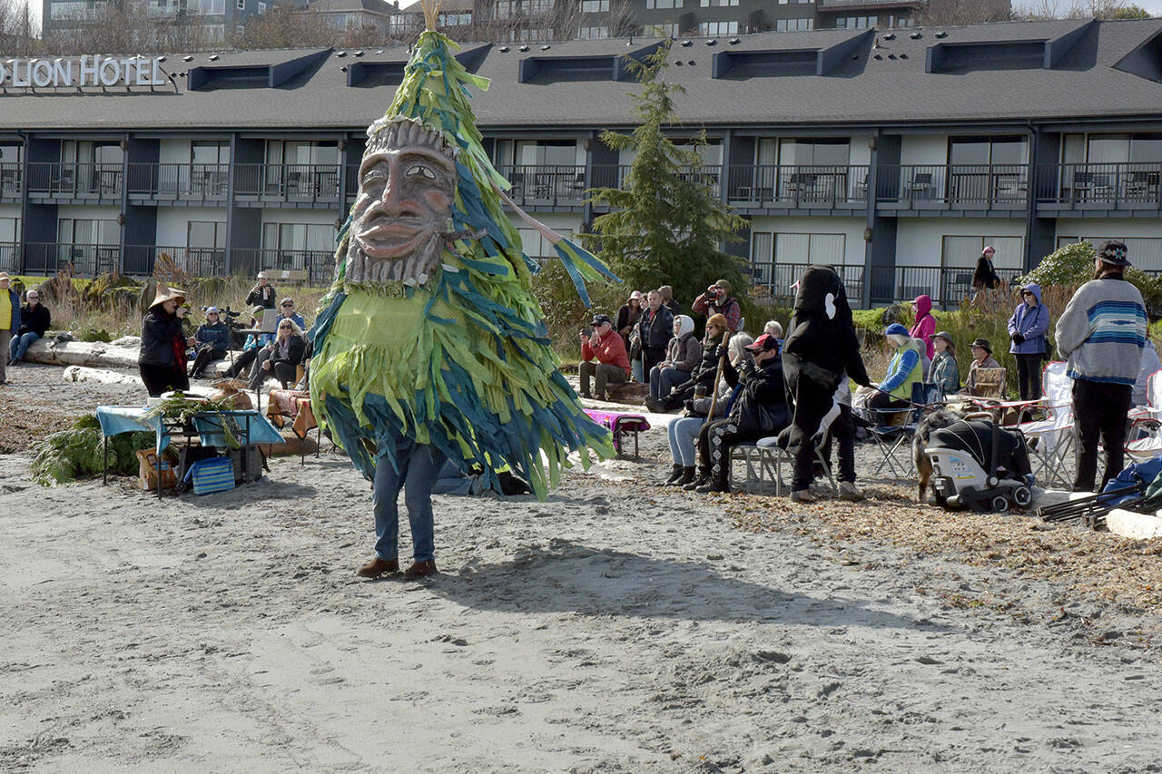 Danielle Fodor of Irondale cavorts as a dancing tree during Saturday’s World Water Day festivities at Hollywood Beach in Port Angeles. The international event served as a call to action to advocate for sustainable management of fresh water resources and environmental conservation. In Port Angeles, the celebration included a water blessing and guided hikes on local trails in the Elwha River watershed. (Keith Thorpe/Peninsula Daily News)