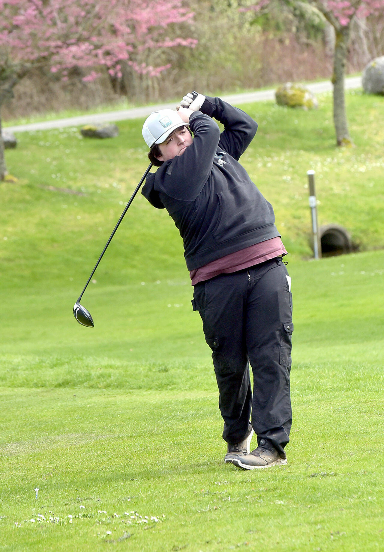 KEITH THORPE/PENINSULA DAILY NEWS Max Gagnon of Port Angeles tees off on Thursday at Peninsula Golf Course.