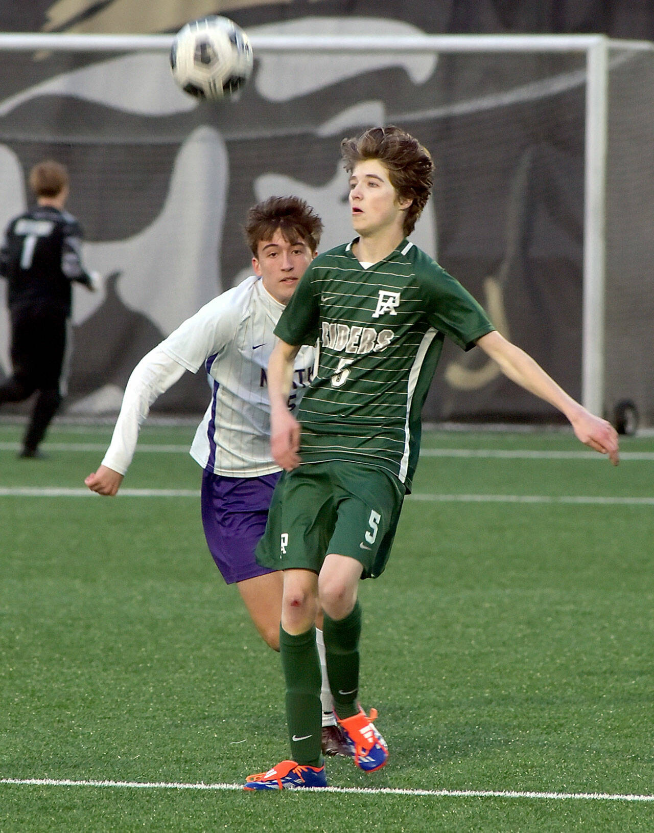 KEITH THORPE/PENINSULA DAILY NEWS Port Angeles’ Harper Willis, right, looks at a loose ball in front of North Kitsap’s Gavin Alfonso on Friday at Peninsula College.