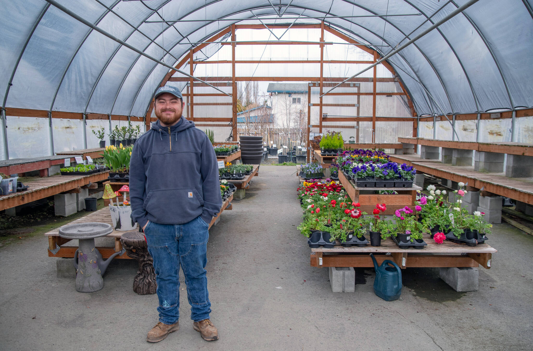 Emily Matthiessen/Olympic Peninsula News Group
Stew Cockburn stands in the spring annual section prior to it being for early spring gardeners.