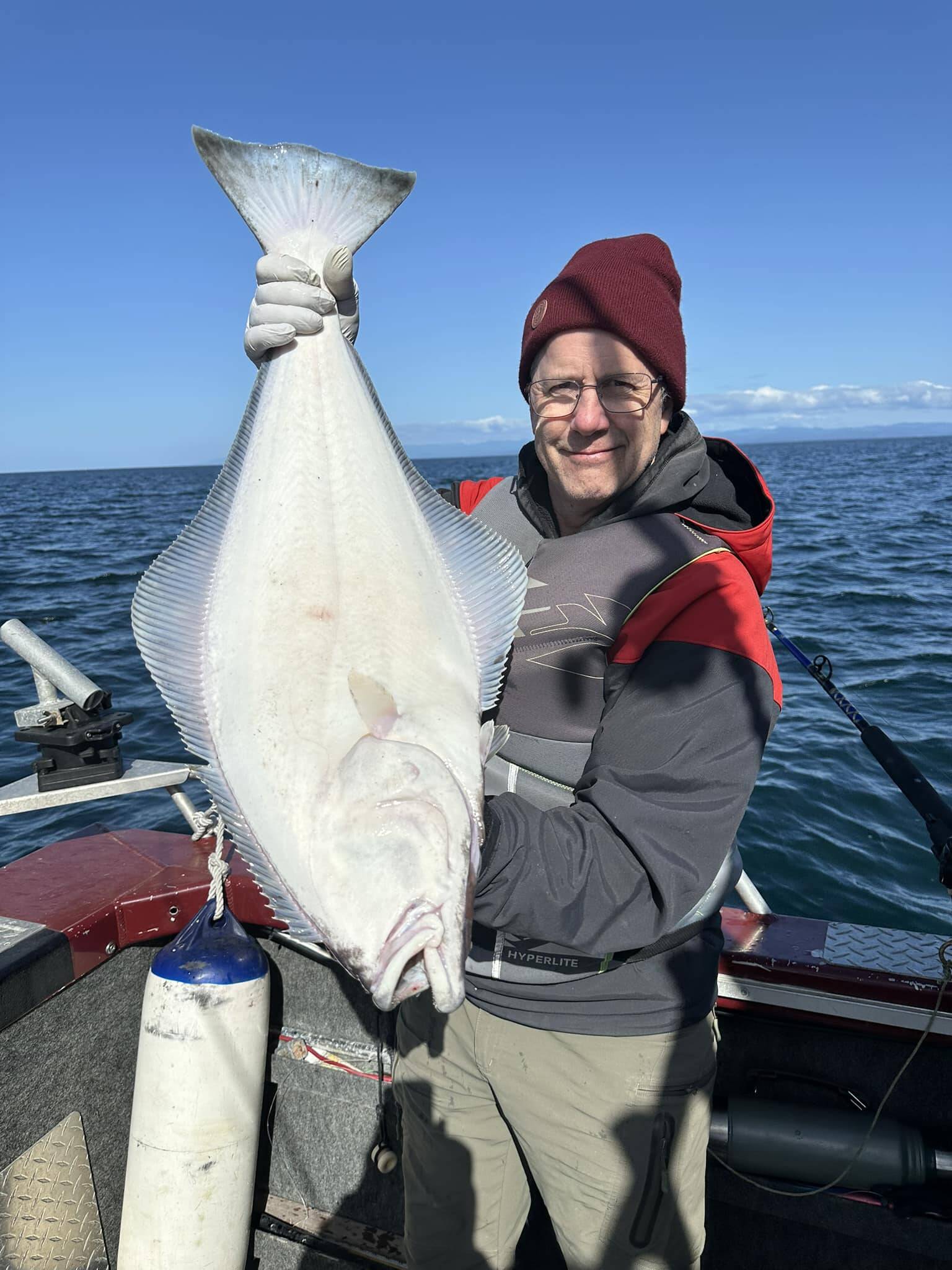 John Beath 
Charter captain John Beath displays a halibut caught in waters of the Strait of Juan de Fuca off Port Angeles on Thursday, the opening day of halibut season in the Strait and Puget Sound.