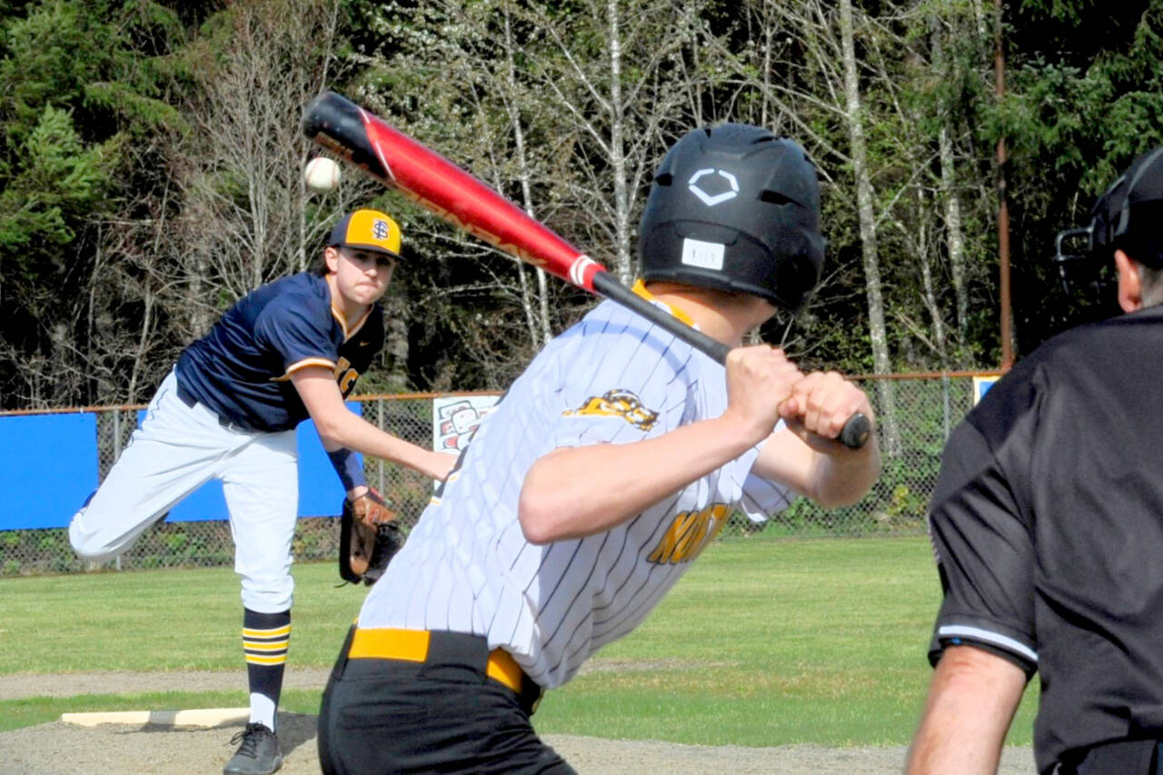 Forks pitcher Conner Clark delivers the pitch to the North Beach batter on Tuesday at the Fred Orr Memorial Field where Forks took both games of this double header 8-1 and 24-3. (Lonnie Archibald/Peninsula Daily News)