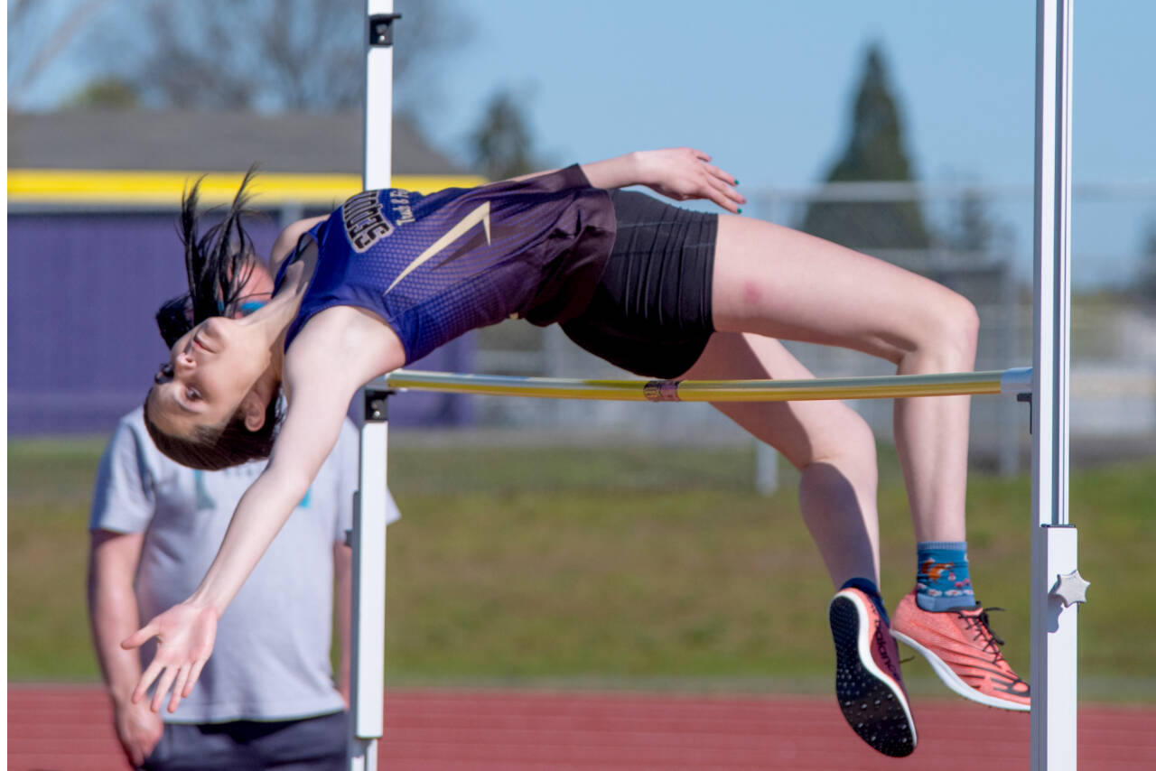 Sequim's Clare Turella competes in the high jump in Thursday's meet in Sequim. (Emily Mathiessen/Olympic Peninsula News Group)