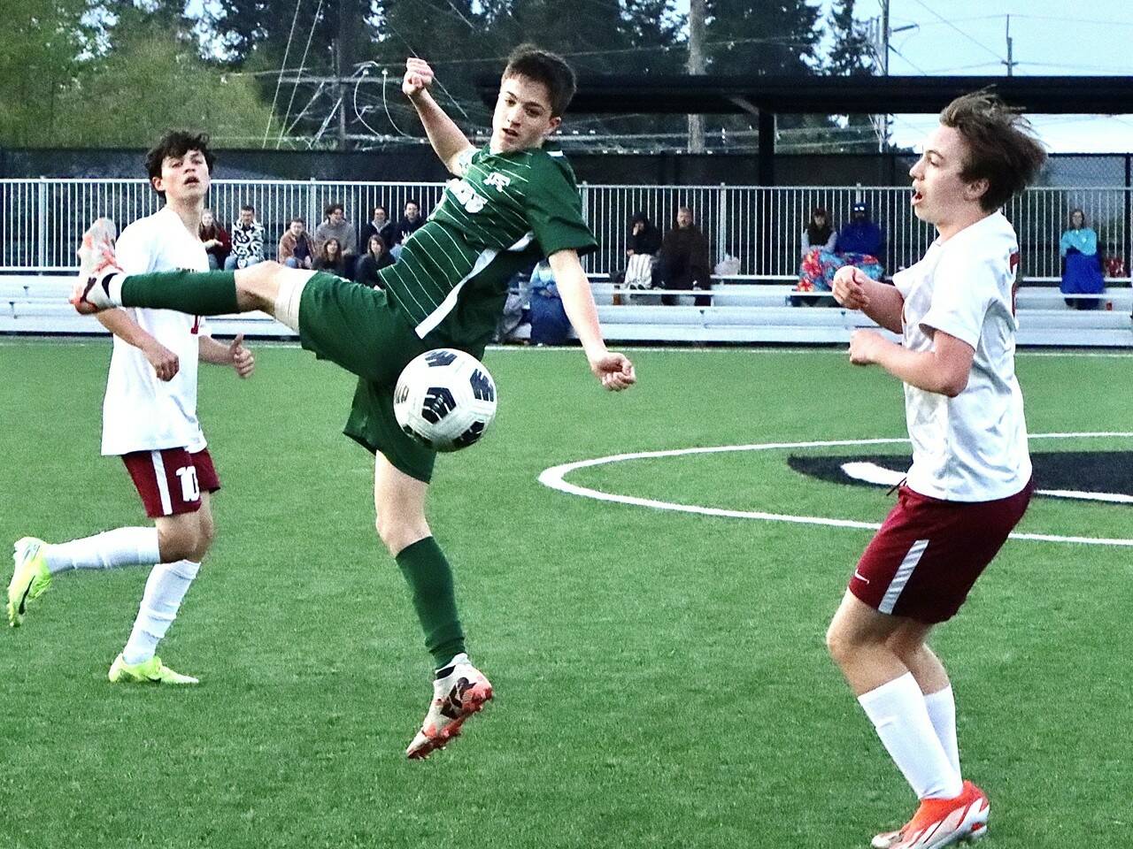 Port Angeles' Kanyon Anderson battles for a ball against Kingston on Friday. The Roughriders won their fourth league game in a row 4-2 over the Buccaneers, putting their record at 6-2 in league. Anderson had an assist and drew a foul that led to another goal. (Dave Logan/for Peninsula Daily News)