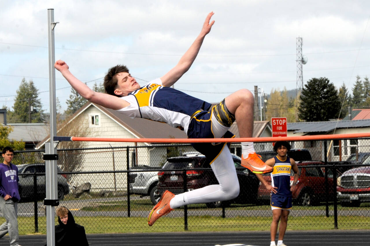 Forks’ Gage Willenbrink leaps in the high jump at the Forks Lions Club Track and Field Invite on Saturday. Willenbrink finished third in the high jump with a height of 5 feet, 6 inches. (Lonnie Archibald/for Peninsula Daily News)