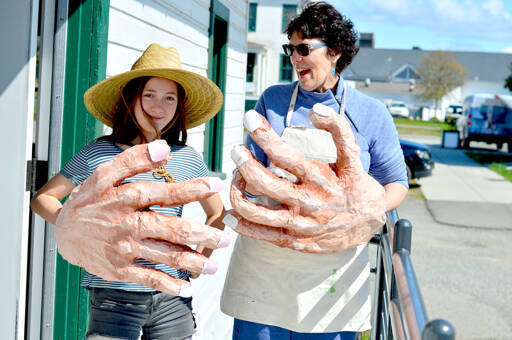 Eponine Bertucci-Kenyon, left, and teaching artist Michele Soderstrom show off the hands they painted for Bertucci-Kenyon’s piece in the Student Wearable Art Show. The show has two performances Saturday afternoon at the Port Townsend High School auditorium. (Diane Urbani de la Paz/for Peninsula Daily News)