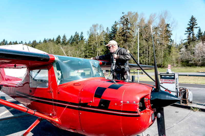 Fred Lundahl, a pilot from Whidbey Island, prepares to fuel up his 1968 Cessna Aerobat, named Scarlett, at the Jefferson County International Airport in Port Townsend. Lundahl was picking up his plane Wednesday from Tailspin Tommy’s Aircraft Repair facility located at the airport. (Steve Mullensky/for Peninsula Daily News)