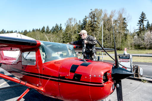 Fred Lundahl, a pilot from Whidbey Island, prepares to fuel up his 1968 Cessna Aerobat, named Scarlett, at the Jefferson County International Airport in Port Townsend. Lundahl was picking up his plane Wednesday from Tailspin Tommy’s Aircraft Repair facility located at the airport. (Steve Mullensky/for Peninsula Daily News)