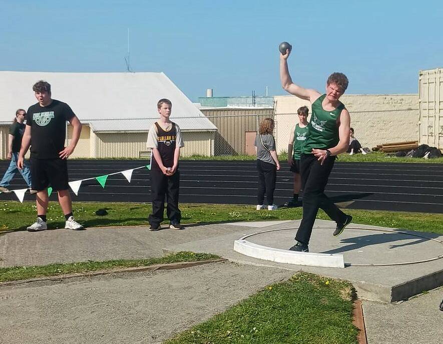 Port Angeles' Maximus Delano competes in the shot put in Thursday's track meet with Bainbridge and Clallam Bay at Port Angeles High School. Delano finished fifth with a put of 35-0 and later won the discus. (Pierre LaBossiere/Peninsula Daily News)