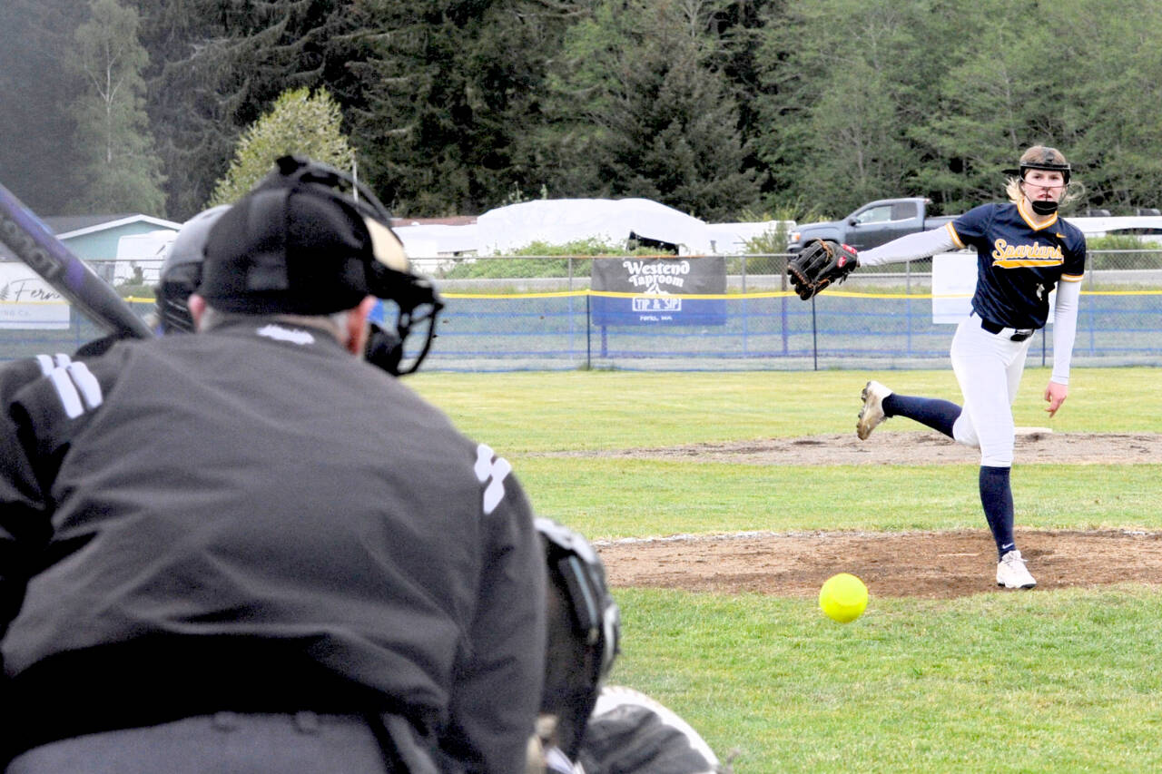 Forks’ Bailey Johnson delivers a pitch to an Ilwaco batter Tuesday in Forks. Johnson hit two home runs on the day and was part of a no-hitter in the second game of a doubleheader as Forks swept the Fishermen. (Lonnie Archibald/for Peninsula Daily News)