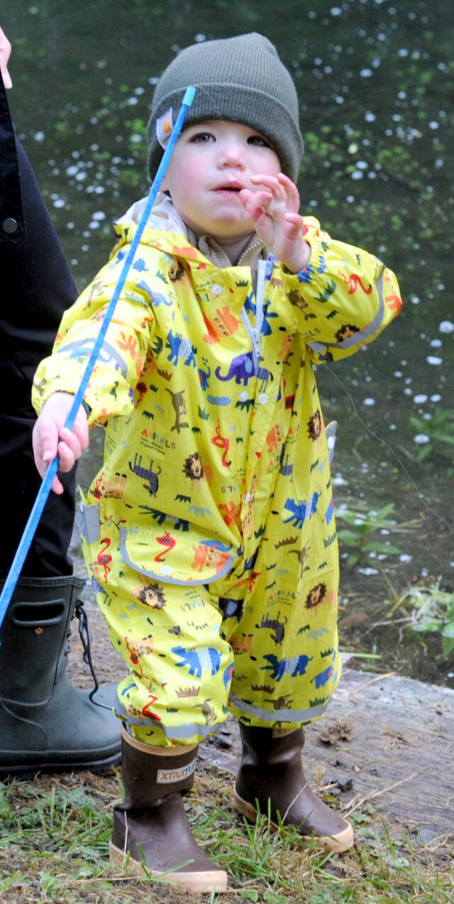 Lonnie Archibald/for Peninsula Daily News
Cole Johanson, 2, makes a final adjustment to his line and lure before casting into the Bogachiel Rearing Pond on Sunday during the annual Kids Fish Day in Forks. About 180 kids 12 and younger participated in the fishing fun sponsored by the West End Sportsmen’s Club. The Forks Elks Lodge also provided complimentary hot dogs, cocoa, donuts and coffee.