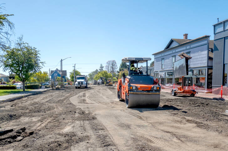 A road roller from Northern Asphalt compacts the dirt on Tyler Street in Uptown Port Townsend. The asphalt work may be finished by today to allow for striping so the street will be open in time for Saturday’s Farmers Market. (Steve Mullensky/for Peninsula Daily News)