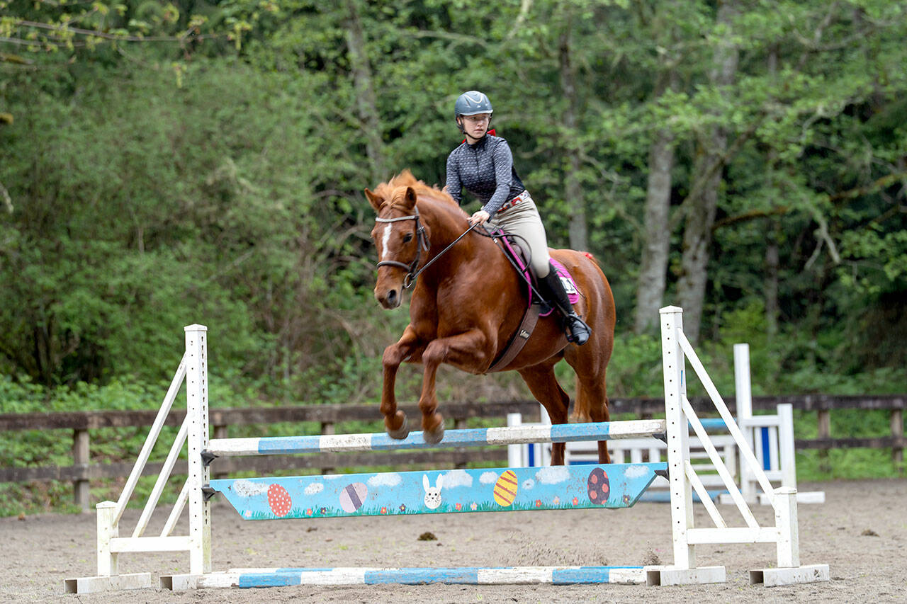 Kimi Robertson
Freedom Farm Hoof Beats member Lily Robertson and her horse Queen of Hearts (Ruby) showed excellent style and form, placing first in the 95-meter jumper class at the Bainbridge Saddle Club’s first Hunter/Jumper Show of the season.