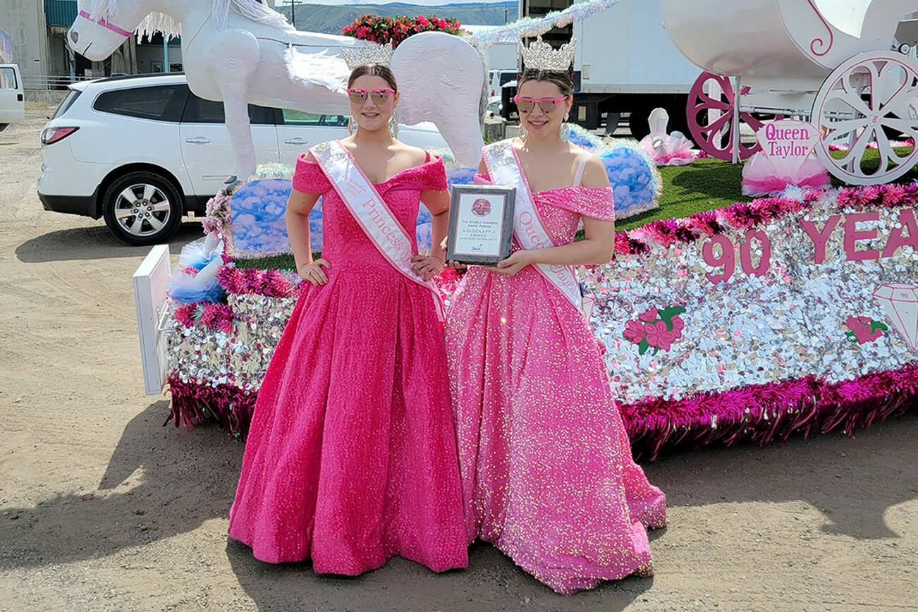 Rhody Princess Lorelei Turner, left, and Rhody Queen Taylor Frank at the Washington State Apple Blossom Festival in Wenatchee, where they received the Golden Apple award. (Lori Morris)