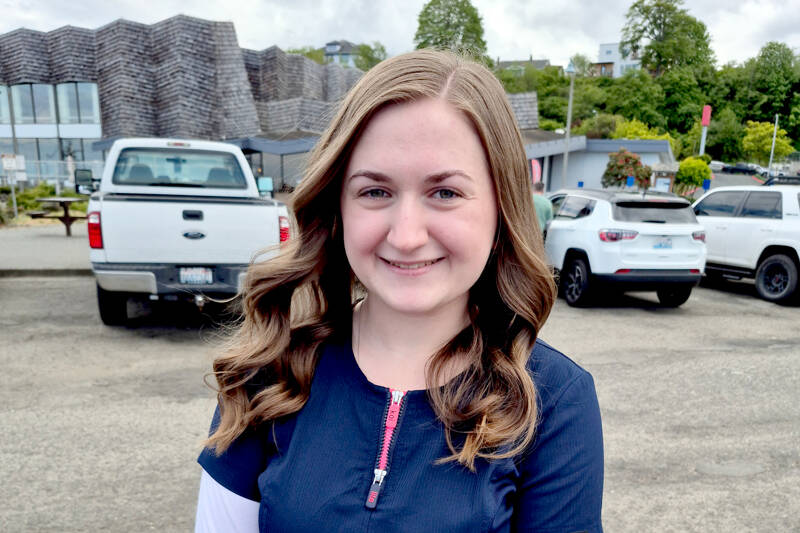 Kaylee Oldemeyer, a second-year nursing student, is among those selling tickets for the Great Olympic Peninsula Duck Derby this Sunday. (Leah Leach/for Peninsula Daily News)