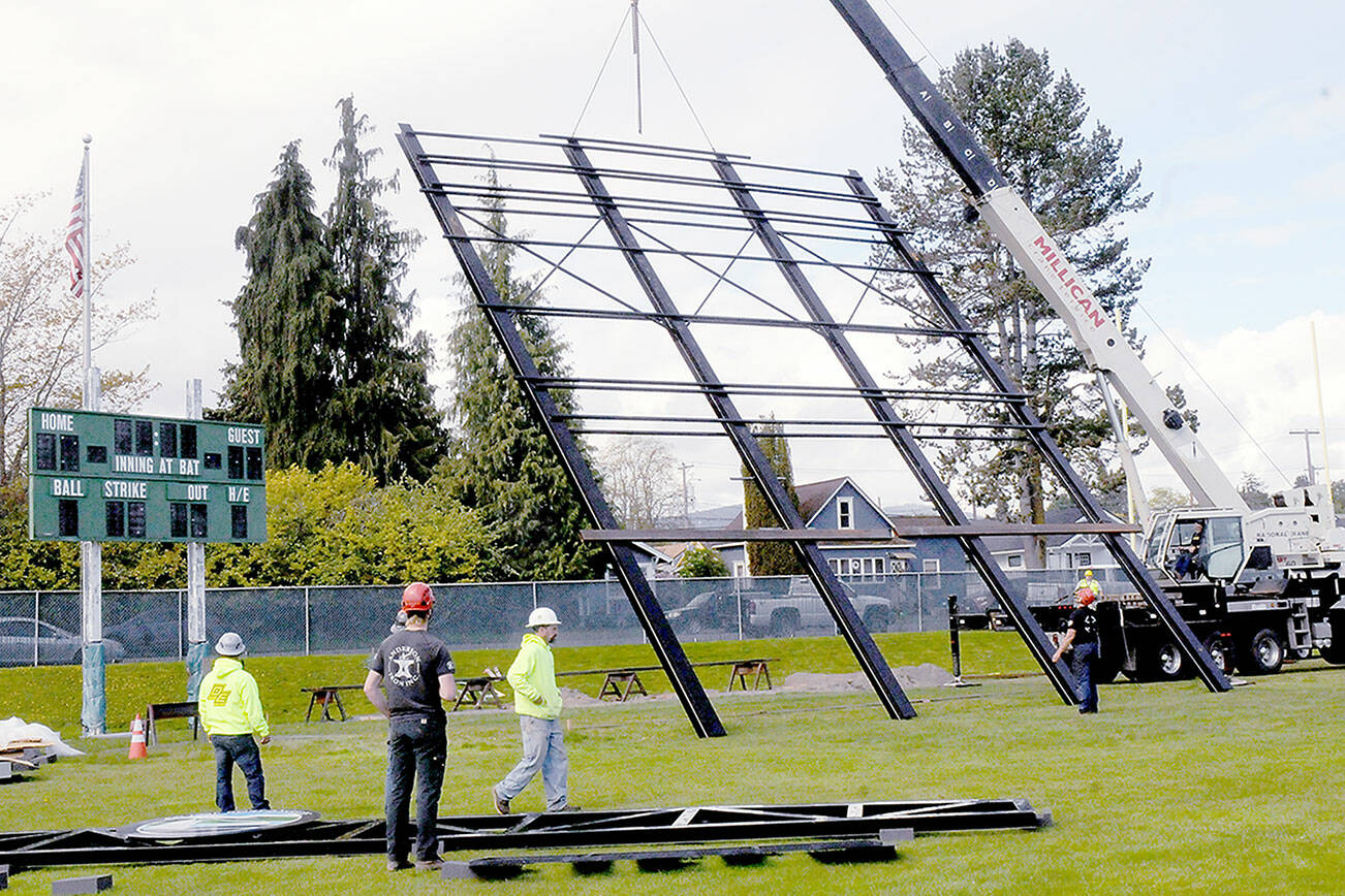 A crane lifts the framework for a new scoreboard being installed at Port Angeles Civic Field. The nearly $1 million, 40-foot-wide scoreboard, which dwarfs the field’s old board, is expected to be operational in time for opening day of the Port Angeles Lefties baseball season on May 30. About $800,000 came from state funding through the West Coast League, and $120,000 in Port Angeles Lodging Tax funds also were awarded. Due to technical issues, final placement of the structure was postponed on Wednesday. (Keith Thorpe/Peninsula Daily News)
