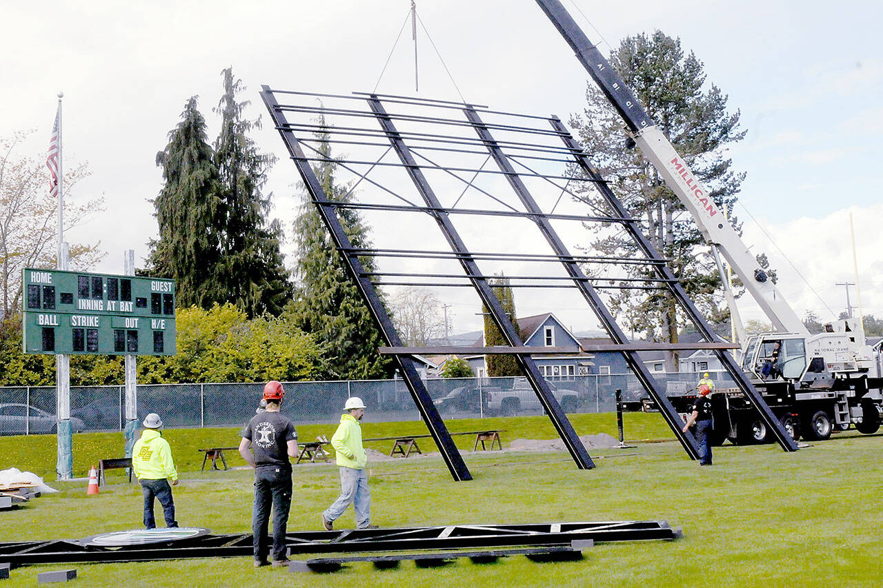 A crane lifts the framework for a new scoreboard being installed at Port Angeles Civic Field. The nearly $1 million, 40-foot-wide scoreboard, which dwarfs the field’s old board, is expected to be operational in time for opening day of the Port Angeles Lefties baseball season on May 30. About $800,000 came from state funding through the West Coast League, and $120,000 in Port Angeles Lodging Tax funds also were awarded. Due to technical issues, final placement of the structure was postponed on Wednesday. (Keith Thorpe/Peninsula Daily News)