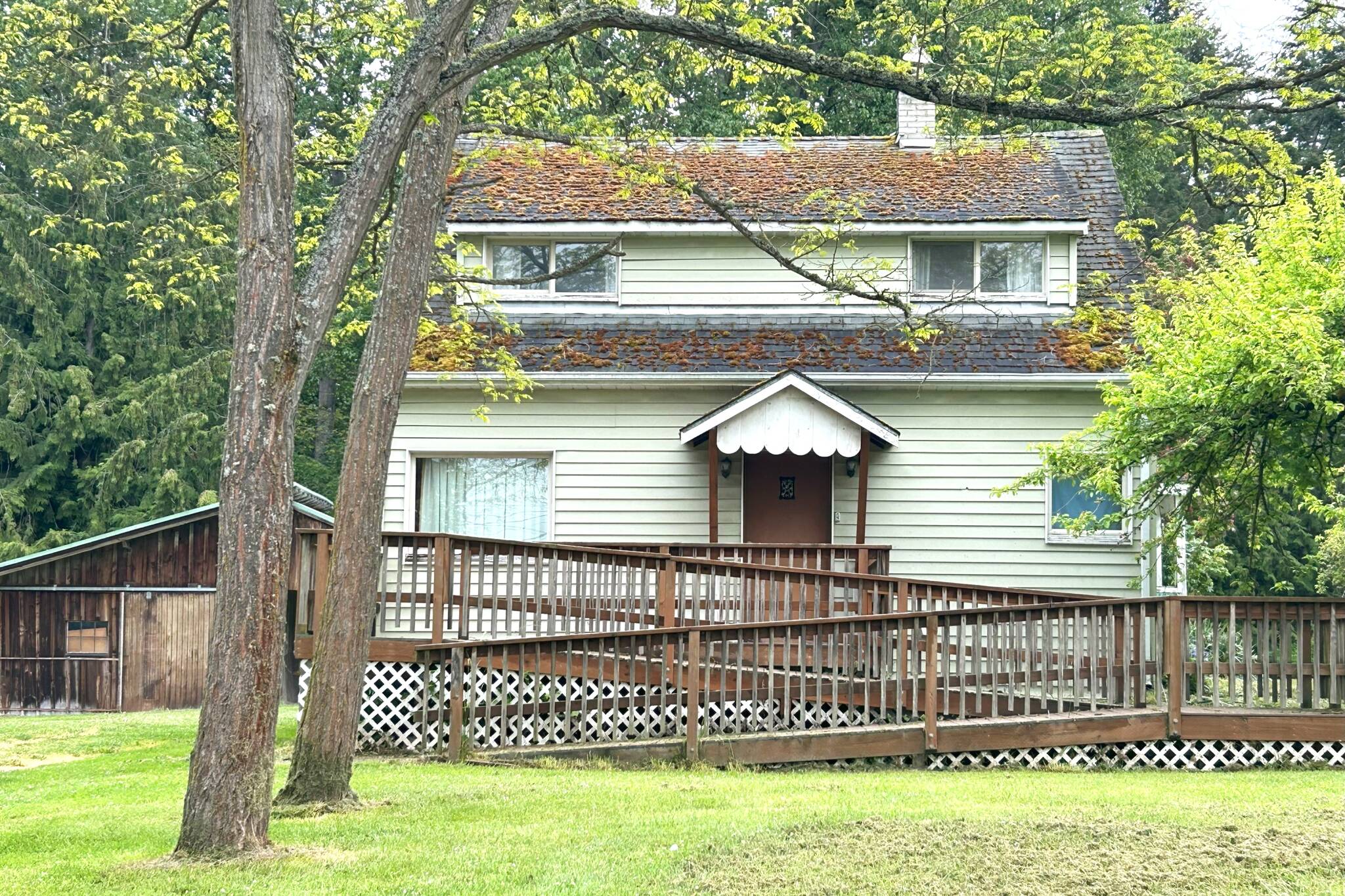 A two-story house and multiple outbuildings at Gerhardt Park will go up for surplus auction through the city of Sequim in the coming weeks. The property was given to the city in exchange for water service by husband and wife Anton “Toni” and Rosa Gerhardt. (Matthew Nash/Olympic Peninsula News Group)