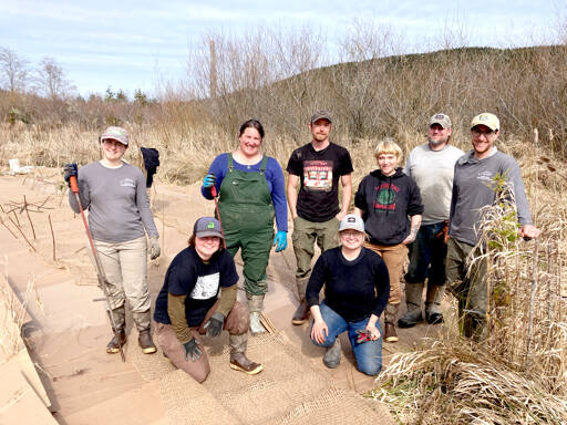 Northwest Watershed Institute’s field restoration crew, from left to right, are Megan Brookens, Grace Burke, Hanna Petersen, Bernt Goodson, Eva Ellis, Veronica Phelan, Zach Hawkes and Wesley Meyers. They worked at a restoration site at the Tarboo Wildlife Preserve. (Northwest Watershed Institute)