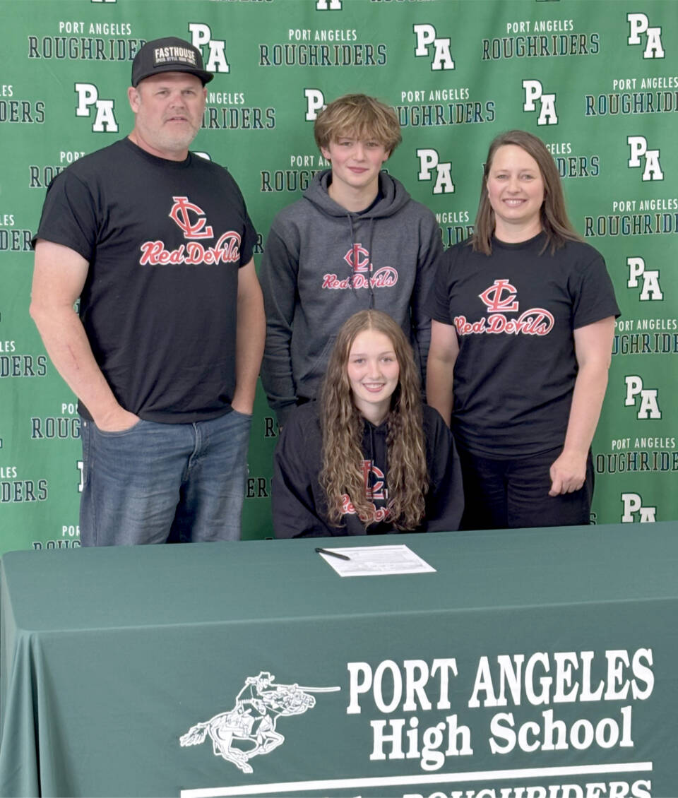 Port Angeles’ Zoe Ernst signs to play soccer for Lower Columbia College surrounded by her, from left, father Jaxon Ernst, brother Clayton Ernst and mother Emily Ernst. (Port Angeles High School)