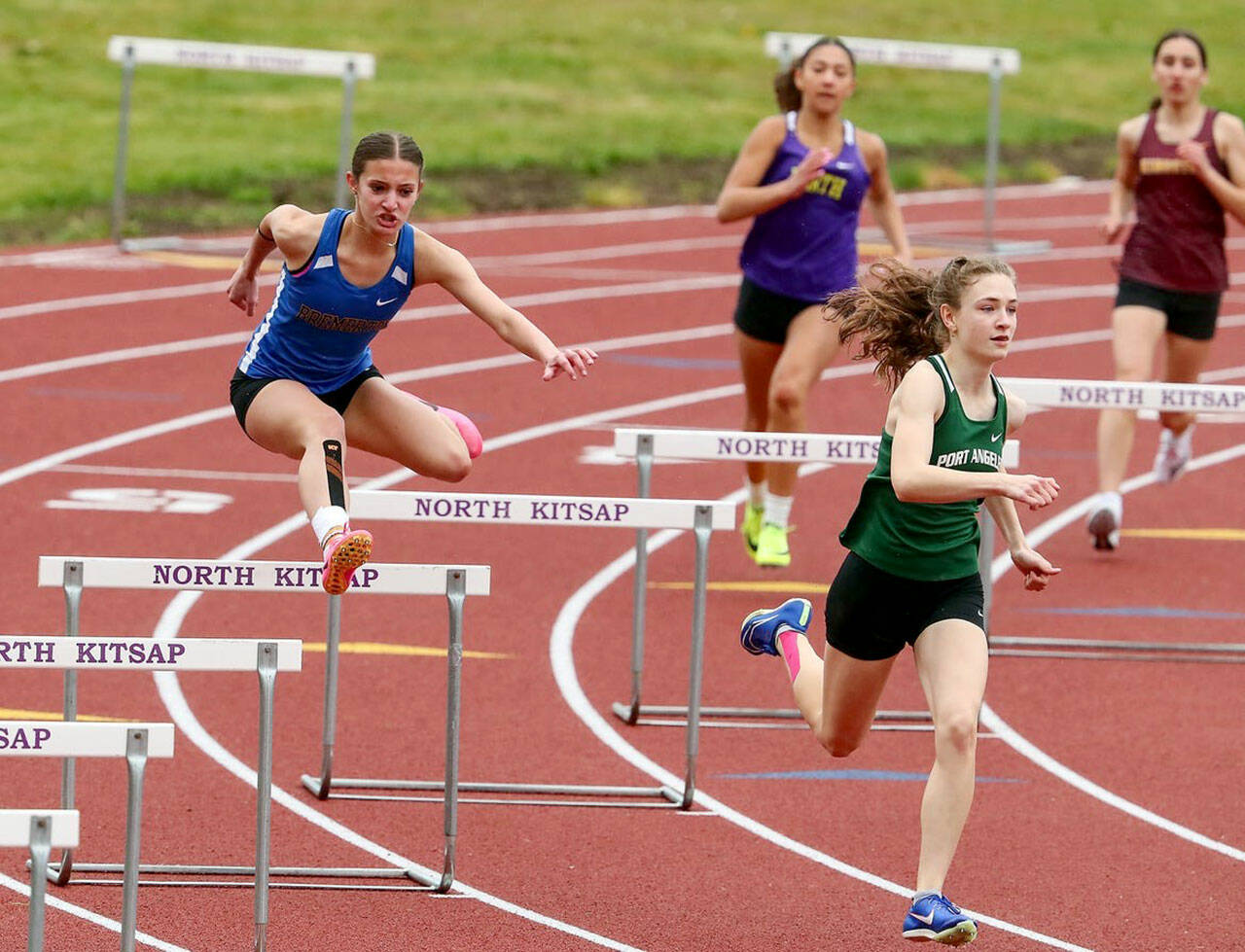 Port Angeles’ Faerin Tait, front, runs in the hurdles during a meet at North Kitsap High School. Tait will compete in the maximum four events at the Class 2A State Track & Field Championship this weekend.