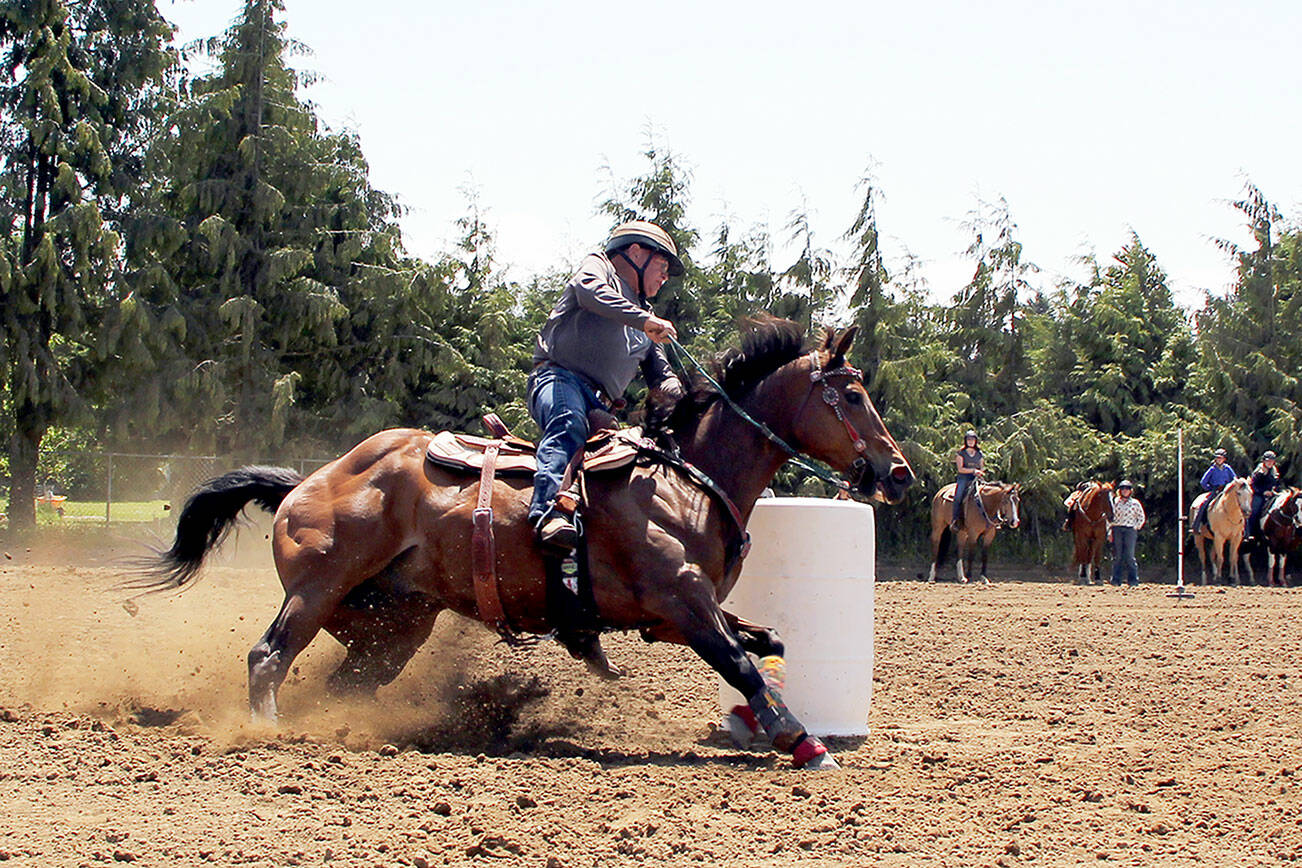 Photos by Karen Griffiths
Top: Earlier this month, Patterned Speed Horse Super Senior Division rider Sam Parks, 74, on Ed, finished the barrel race in just 15.08 seconds at the Crosby arena, 122 Franson Road in Agnew. The next show there will be July 5-6. Bottom: 4L arena belt buckle awards.