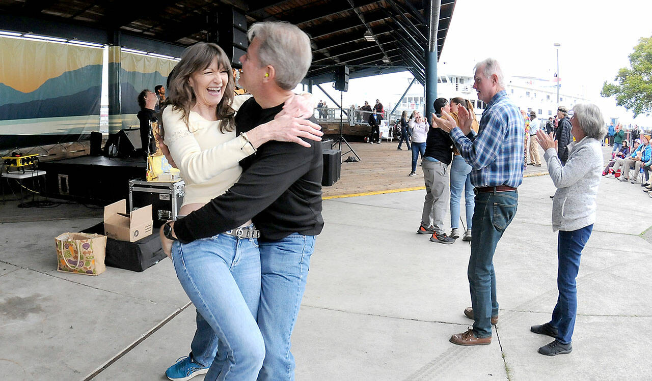 Lorna Kay Smith and Philip Wade, both of Sequim, dance to the music of Rose’s Pawn Shop to kick off the Concert on the Pier music series on Wednesday evening at Port Angeles City Pier. The series, presented by the Juan de Fuca Foundation and sponsored by Strait View Credit Union, D.A. Davidson & Co., 102.1 FM The Strait and Peninsula Daily News, continues at 6 p.m. Wednesday with the Wild Rumors band. (Keith Thorpe/Peninsula Daily News)