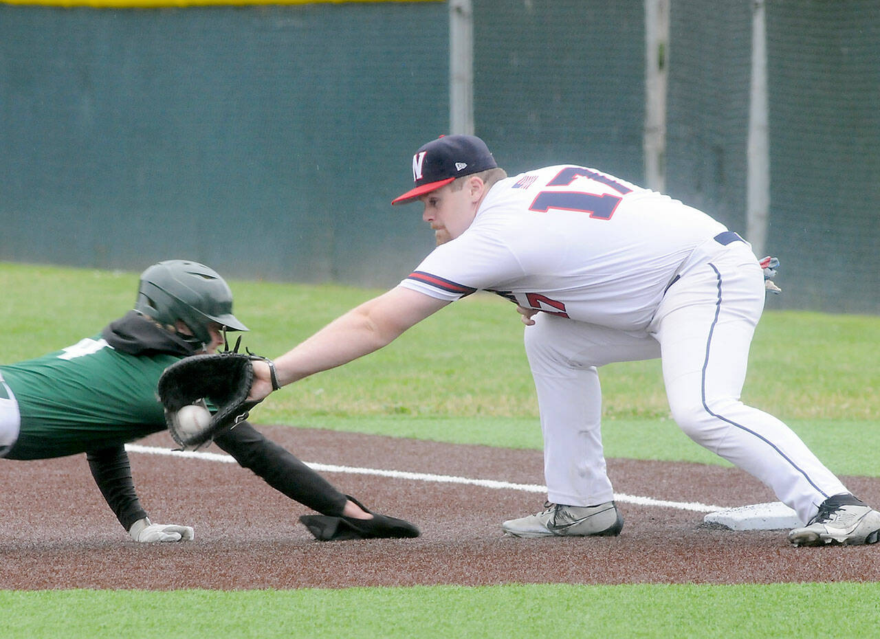 KEITH THORPE/PENINSULA DAILY NEWS Wilder Senior first baseman Ezra Townsend catches CBC Orange baserunner Hudson Neff off the bag for an out on Thursday at Port Angeles’ Volunteer Field during the Dick Brown Memorial Firecracker American Legion baseball tournament.