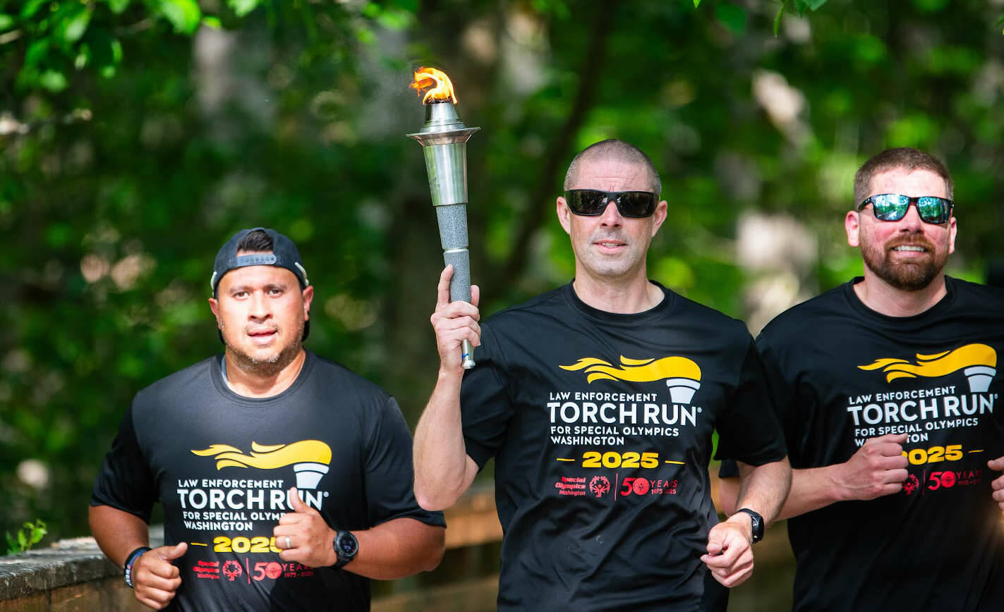 Representatives from the Peninsula Communications team and Port Angeles Police Department were among those from other Clallam County law enforcement agencies who participated in the 2025 Special Olympics Law Enforcement Torch Run. (Jesse Major)