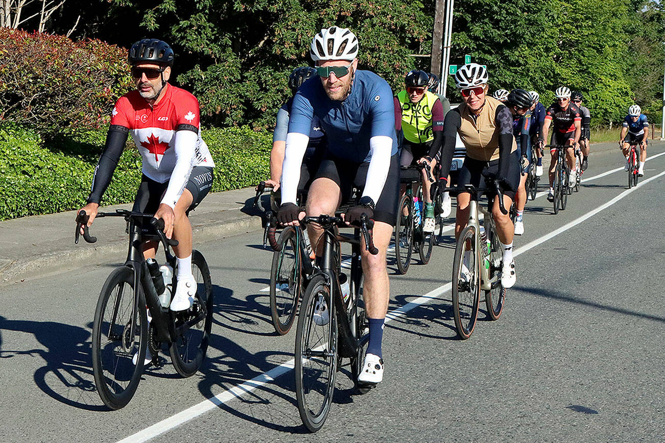 About 15 hardy cyclists from the Victoria area came across on the early Coho ferry Tuesday to ride up to the top of Hurricane Ridge on their Canada Day July 1st. The cyclist made the round trip in about 4 hours in time for the return noon ferry  back home. This yearly trek has been happening for over 20 years and is organized by word of mouth through various cycle shops in the greater Victoria area. The numbers of riders was down considerably this year as riders shared that many felt “uncomfortable" coming over to America with the current political situation.
     ID: The cyclist are riding on 8th Street in PA for their approach to the park entrance. The round trip is about 34 miles. dlogan