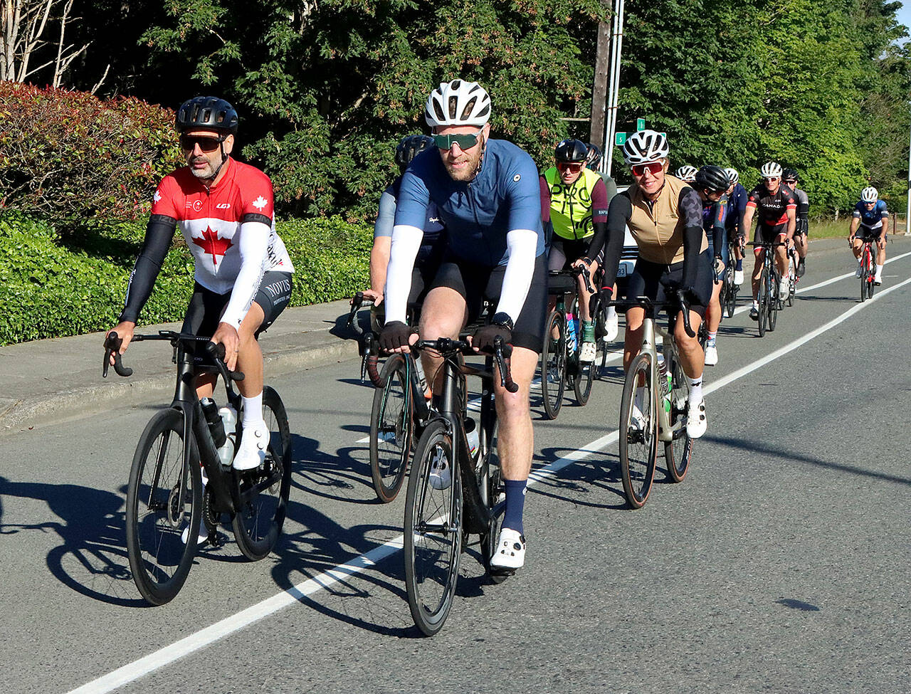 About 15 hardy cyclists from the Victoria, B.C., area came across on the early Coho ferry Tuesday to ride up to the top of Hurricane Ridge on Canada Day. The cyclists made the approximatelt 34-mile roundtrip in about 4 hours, in time for the return noon ferry back home. This yearly trek has been happening for over 20 years and is organized by word of mouth through various cycle shops in the greater Victoria area. The numbers of riders was down considerably this year as riders shared that many felt “uncomfortable” coming over to America with the current political situation. (Dave Logan/For Peninsula Daily News)