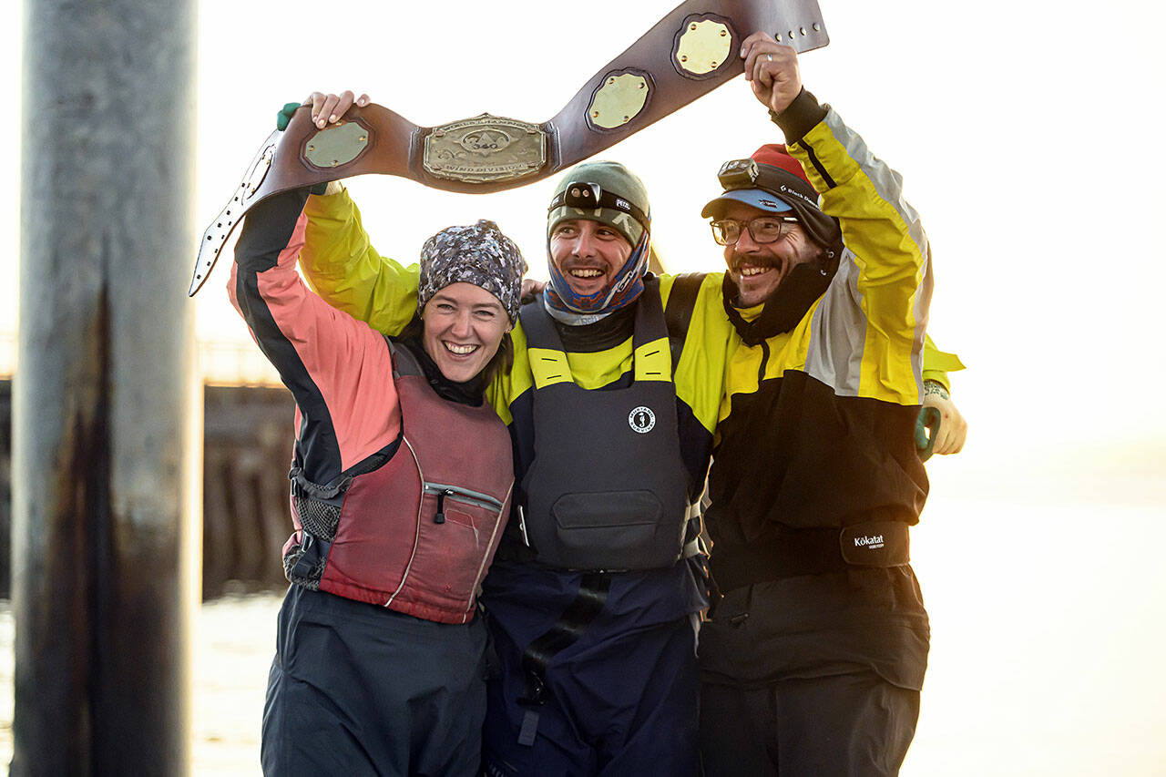 Team Puget Sound Navigation Company from left to right; Molly Karas, Michael Karas and Anthony Boscolo celebrating with their champion belt, July 1. (Jim Meyers)