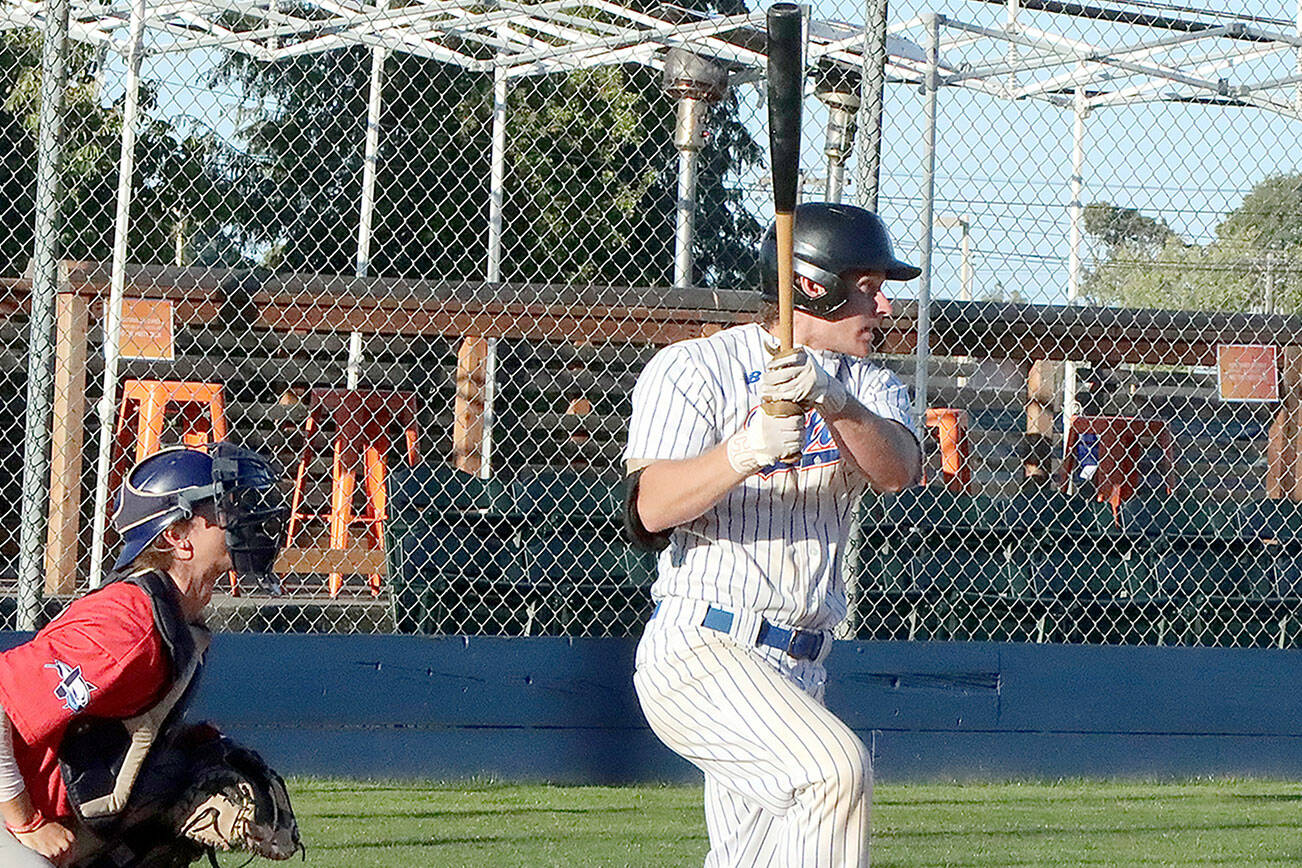 Dave Logan/for Peninsula Daily News
Port Angeles' Tyler  Shulman gets a base hit with his turn at the plate in the first inning.