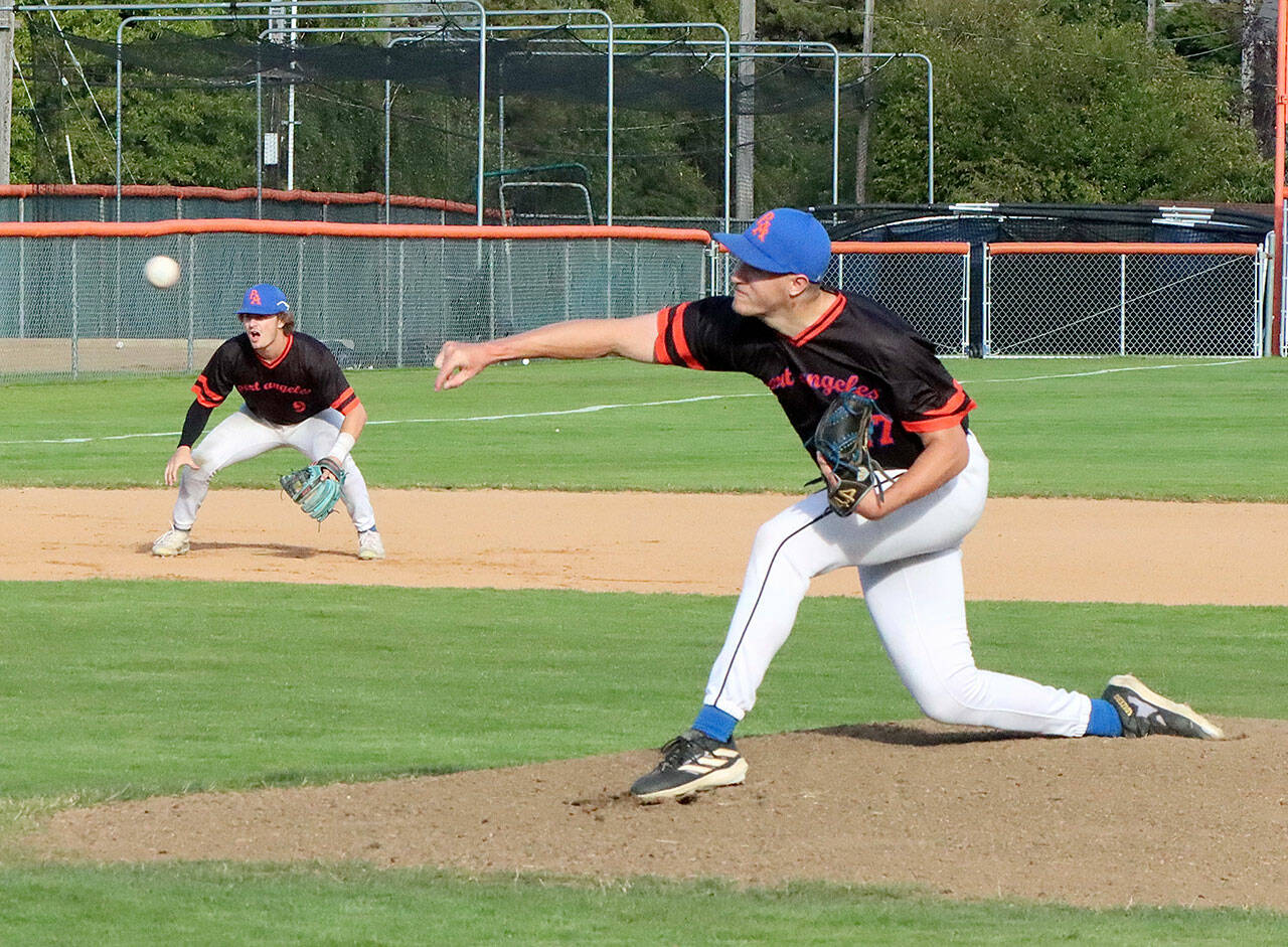 Dave Logan/for Peninsula Daily News
Port Angeles starting pitcher Liam Karlson delivers a pitch during Wednesday night’s contest with the Victoria HarbourCats at Civic Field.