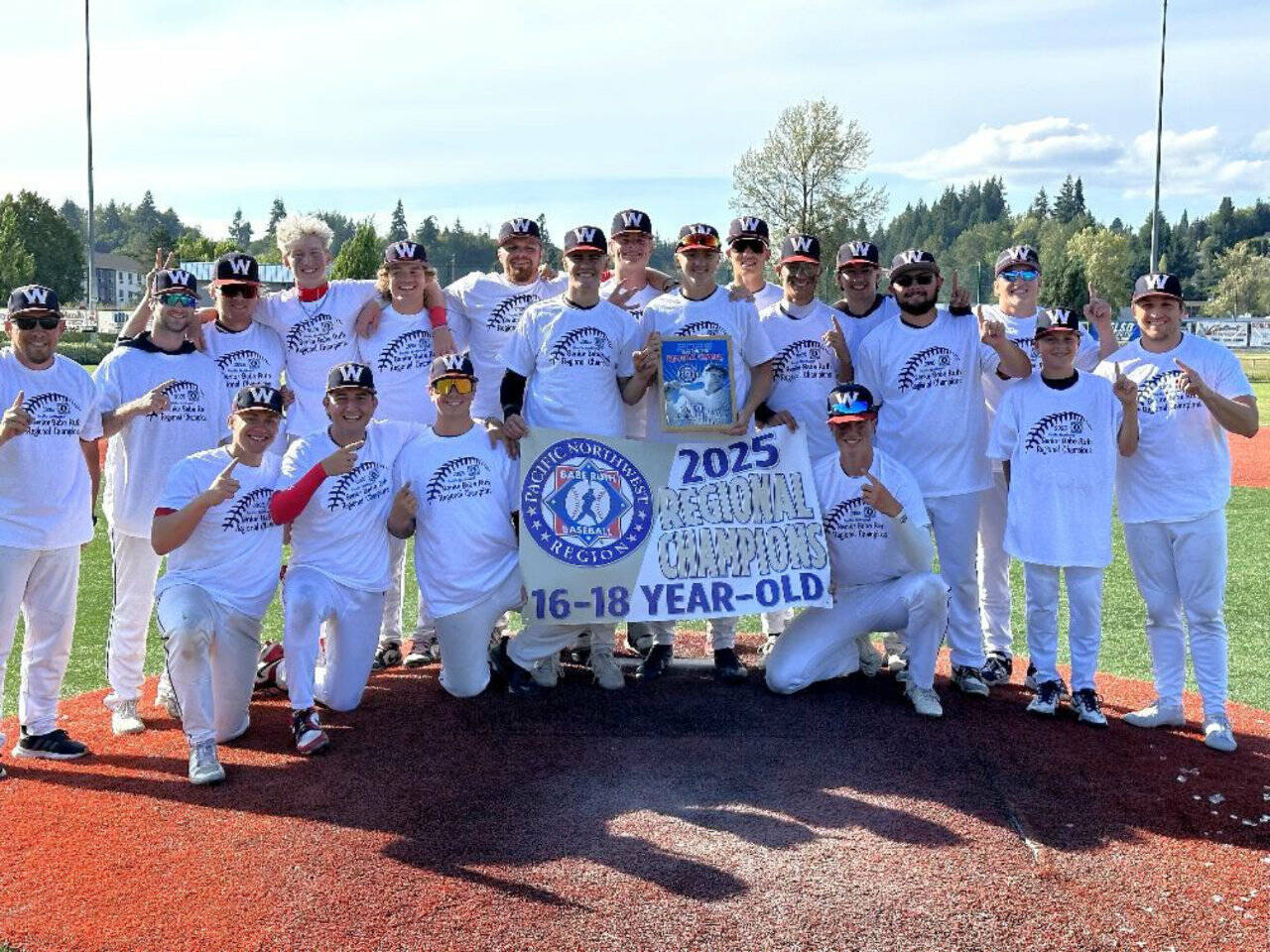 The Wilder Senior Baseball Club celebrates winning the Pacific Northwest Babe Ruth 16-18 tournament in Kelso on Saturday. The seniors qualified to play in the Babe Ruth World Series in Florida. (Zac Moore)