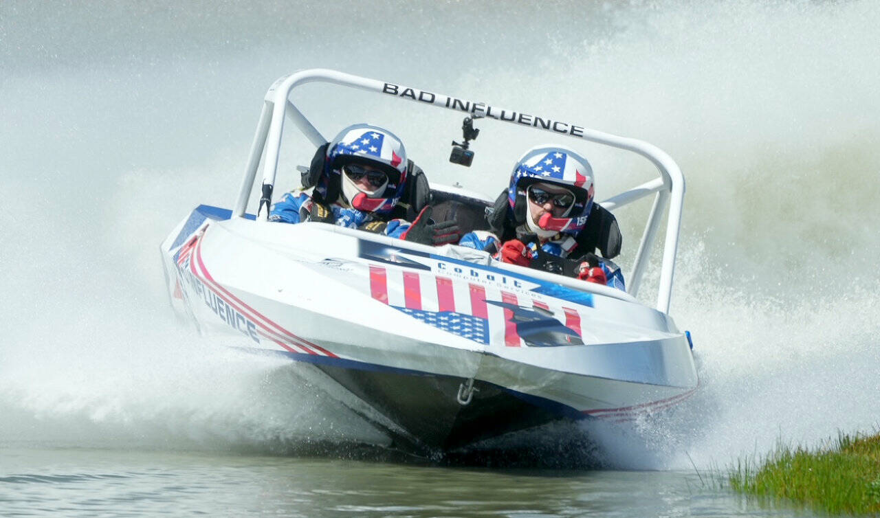 The Bad Influence Boat No. 156 out of Oregon driven by Steve Church and navigated by Randi Church competes in the 400 class at the American Sprint Boat Racing races at the Extreme Sports Park on Saturday west of Port Angeles. Dozens of racers from all around the Pacific Northwest and several from New Zealand competed all weekend at the ESP in the first of two events coming to the Olympic Peninsula. Look in Tuesday’s sports sections for racing results. (Jeff Halstead/for Peninsula Daily News)