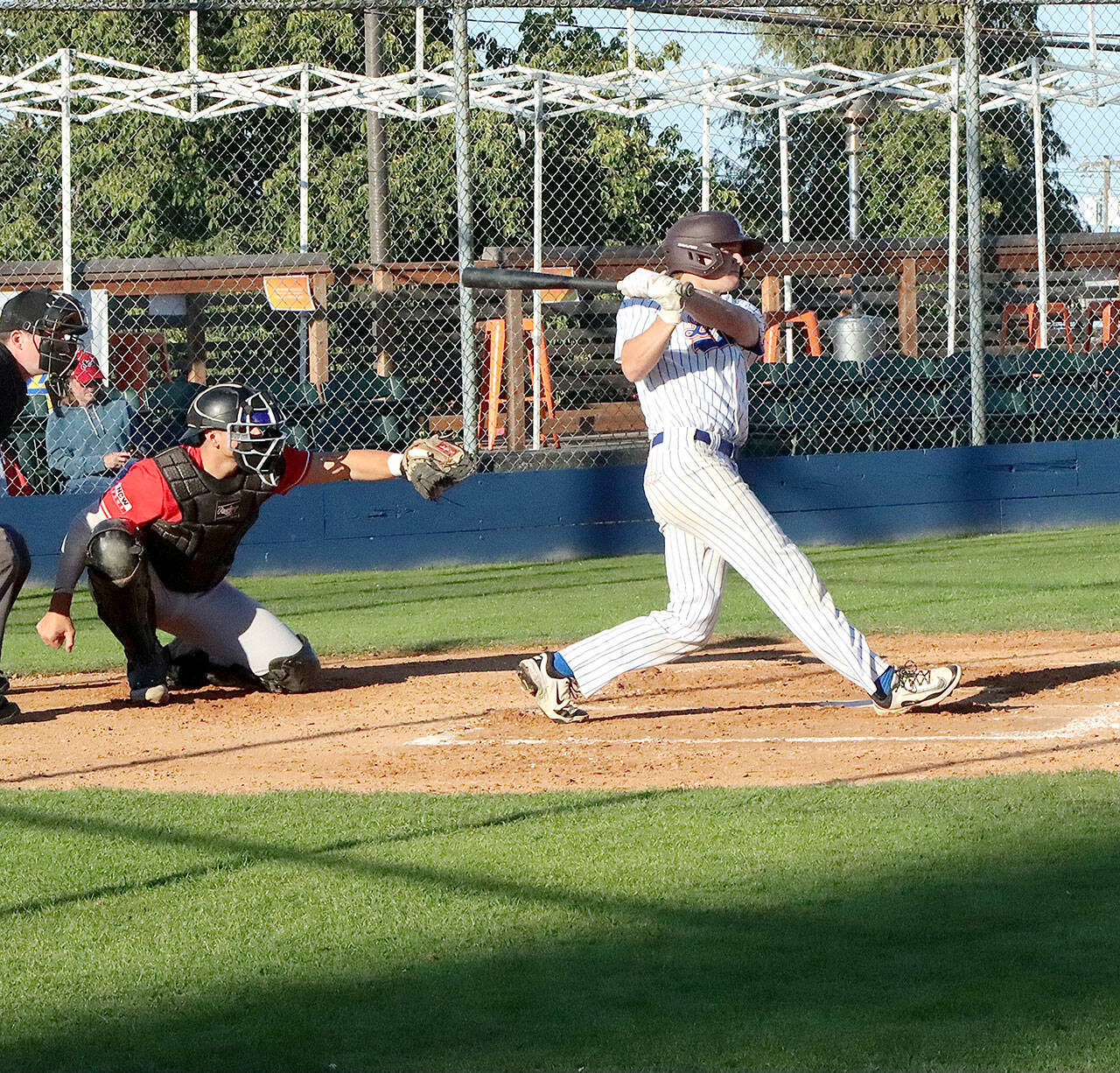 WCL All-Star Tommy Markey swings at pitch against the Wenatchee AppleSox at Civic Field on Monday. Markey had a single and run scored in the Lefties’ 5-2 loss. (Dave Logan/for Peninsula Daily News)