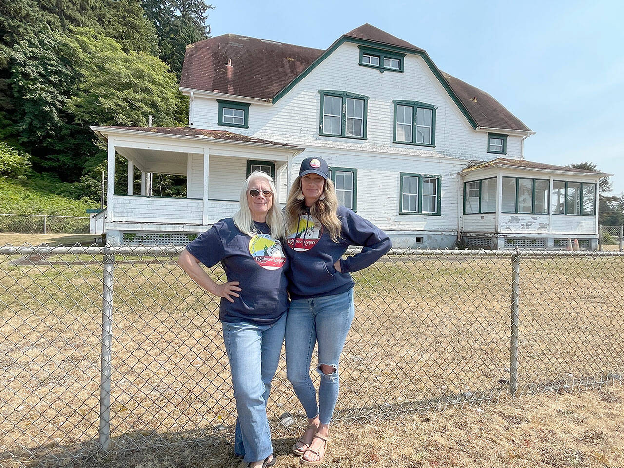 Mother and daughter Susan Heiny, left, and Sarah Winter Grafstrom with the Slip Point Lighthouse Keepers are working to preserve the 1905 keeper’s house, which is on the National Register of Historic Places. The 10-acre property will be conveyed to Clallam County from the U.S. Coast Guard for use as a park after remediation at the site is completed. The lighthouse no longer exists. (Paula Hunt/Peninsula Daily News)