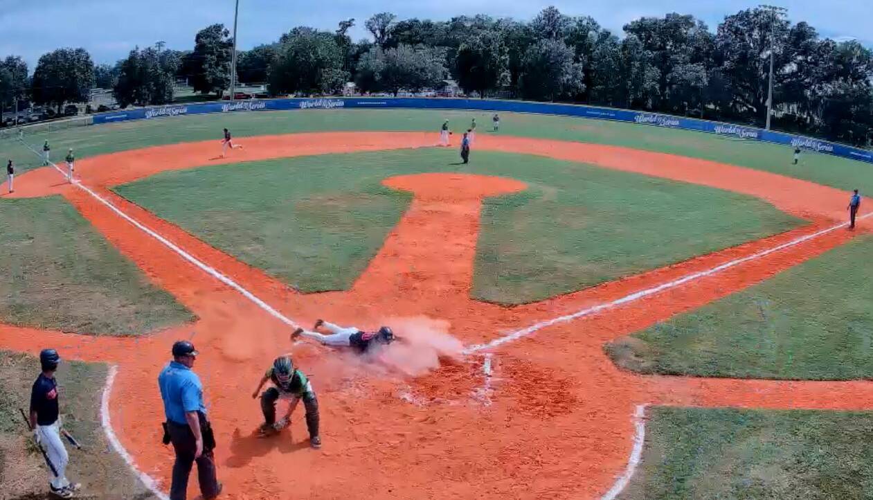 Wilder Senior's Colton Romero slides home after coming all the way around from first base on a Braydan White triple at the Babe Ruth 18U World Series in Ocala, Fla., on Saturday. Wilder Senior beat a team from Australia 16-1. (Gamerchanger)