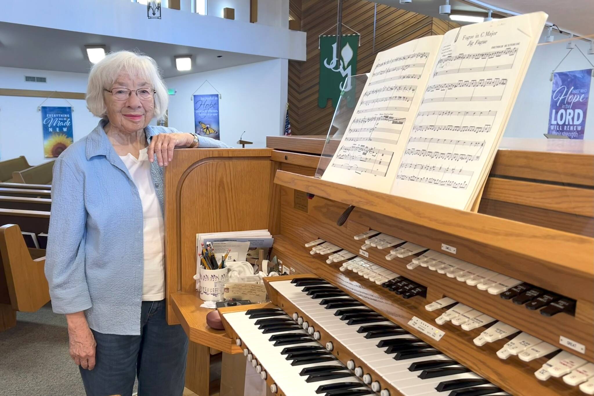 Matthew Nash/Olympic Peninsula News Group
Pat Marcy stands by the organ in Faith Lutheran Church that she’s played since it was built in 1991. This summer marks her 50th year leading music at the church, and with her retirement, a new director of parish music started on Aug. 3.