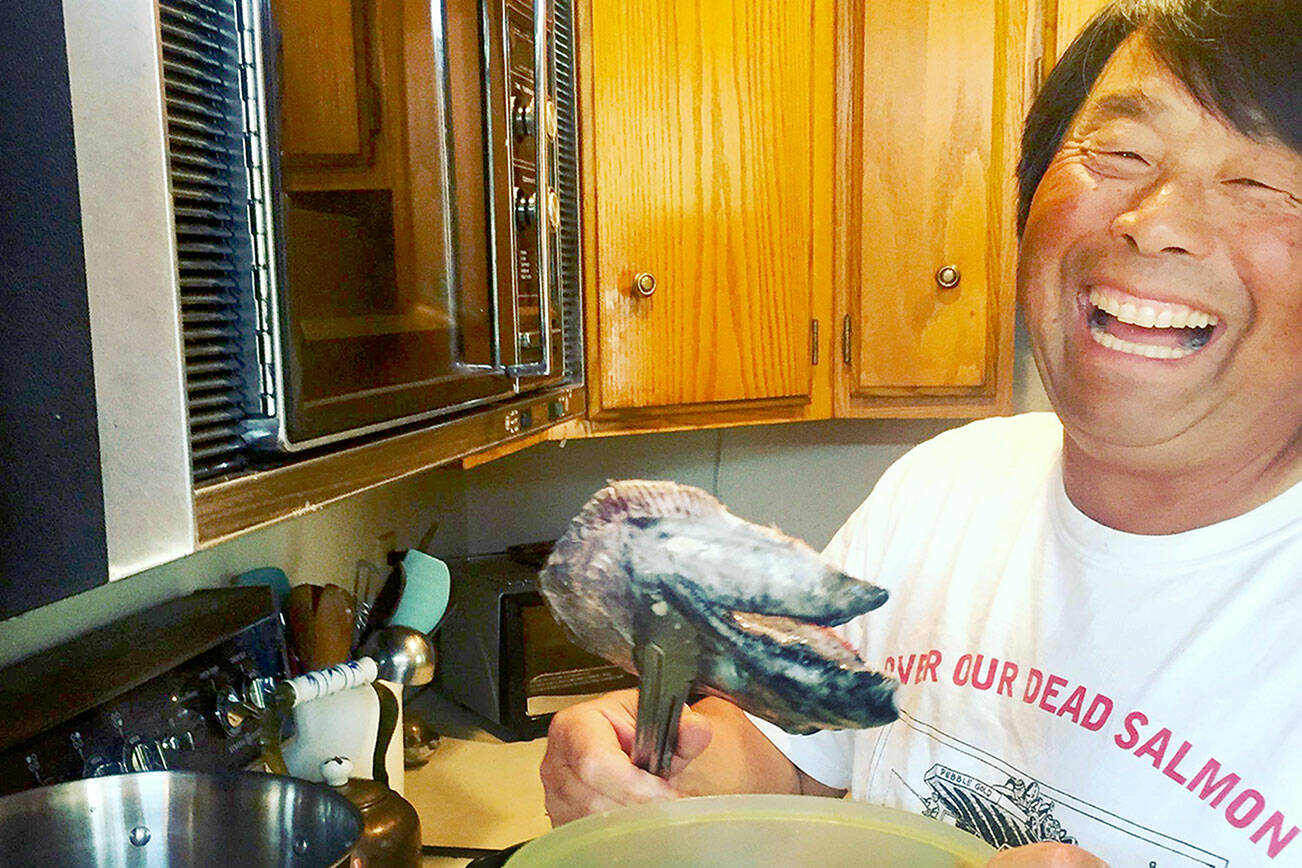 Joel Kawahara prepares his famous fish head stew in 2018. (Kellie Henwood)