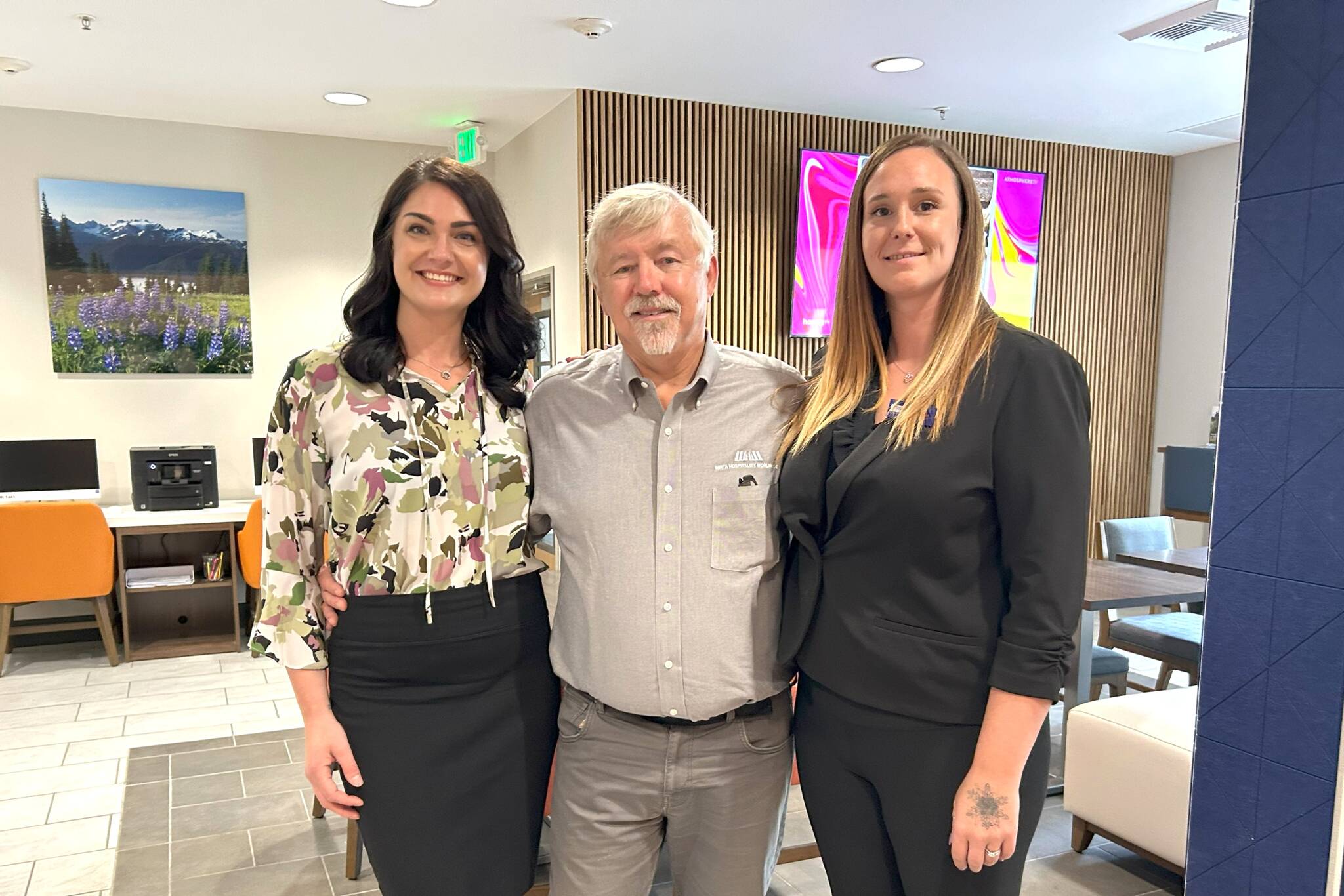Matthew Nash/Olympic Peninsula News Group
Leaders with Holiday Inn Express & Suites, from left, Namaste Stayton, vice president of hotel operations, Bret Wirta, owner, and Shelby Schleve, general manager, stand in “The Great Room” of the Sequim hotel. It was part of a massive $4 million remodeling project that opened up this space, refreshed hotel rooms and suites and added new amenities throughout the building.